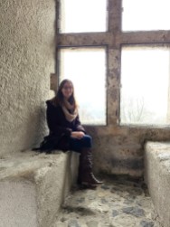 Brianna on the wall of the Castle Gruyere